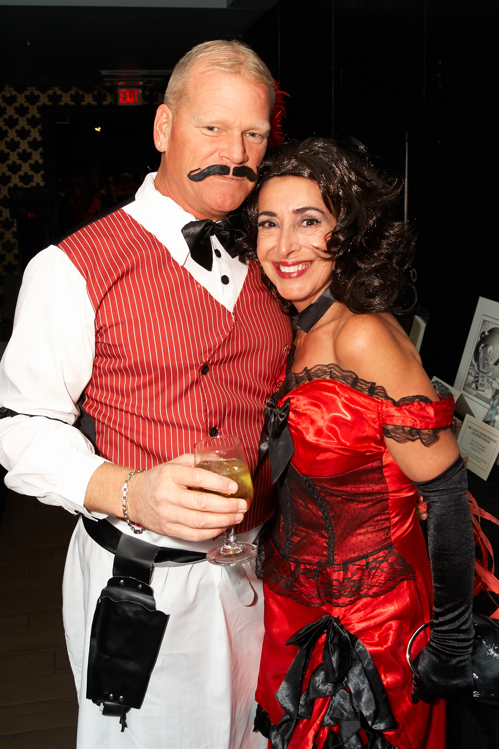 Mike Holmes dressed as an old timely bartender with his wife