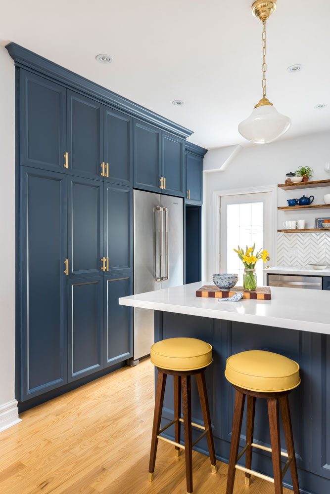 Gorgeous blue floor-to-ceiling custom pantry design.