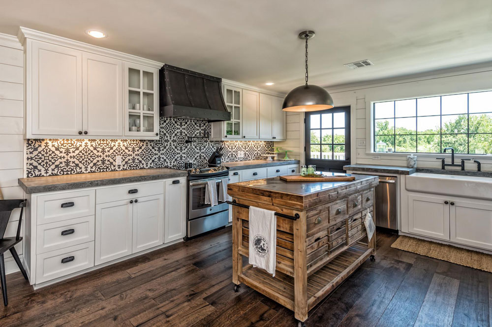 Farmhouse kitchen with reclaimed floors and a dramatic backsplash.