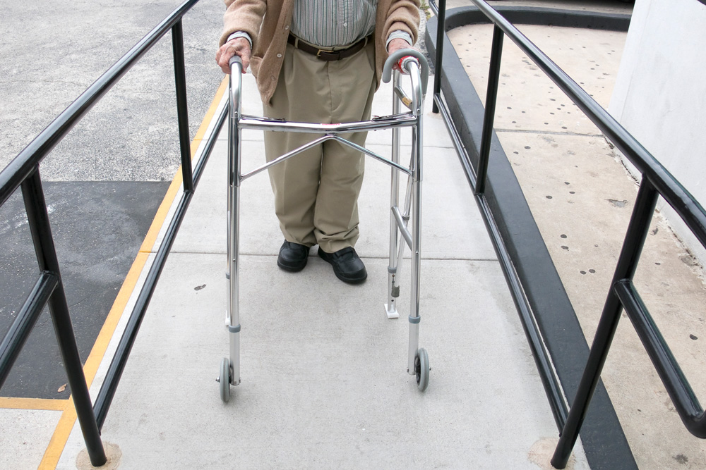 Senior using walker on a ramp