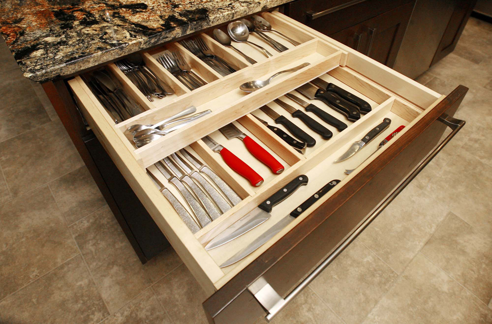 Kitchen drawer organized with cutlery