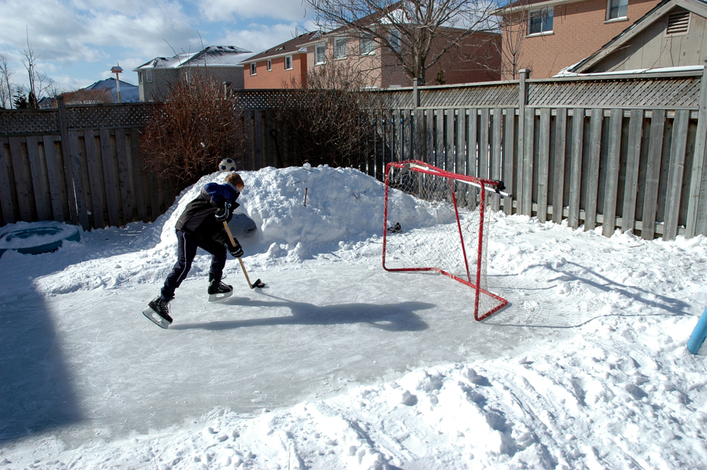 Backyard hockey rink in the winter