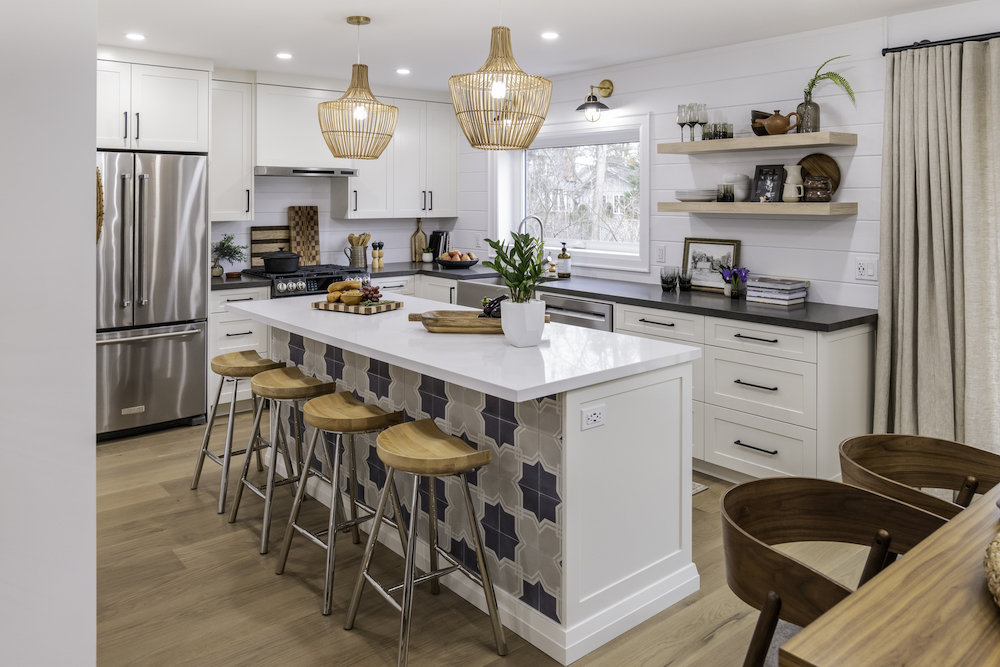 modern white farmhouse kitchen with island with patterned tiles on back