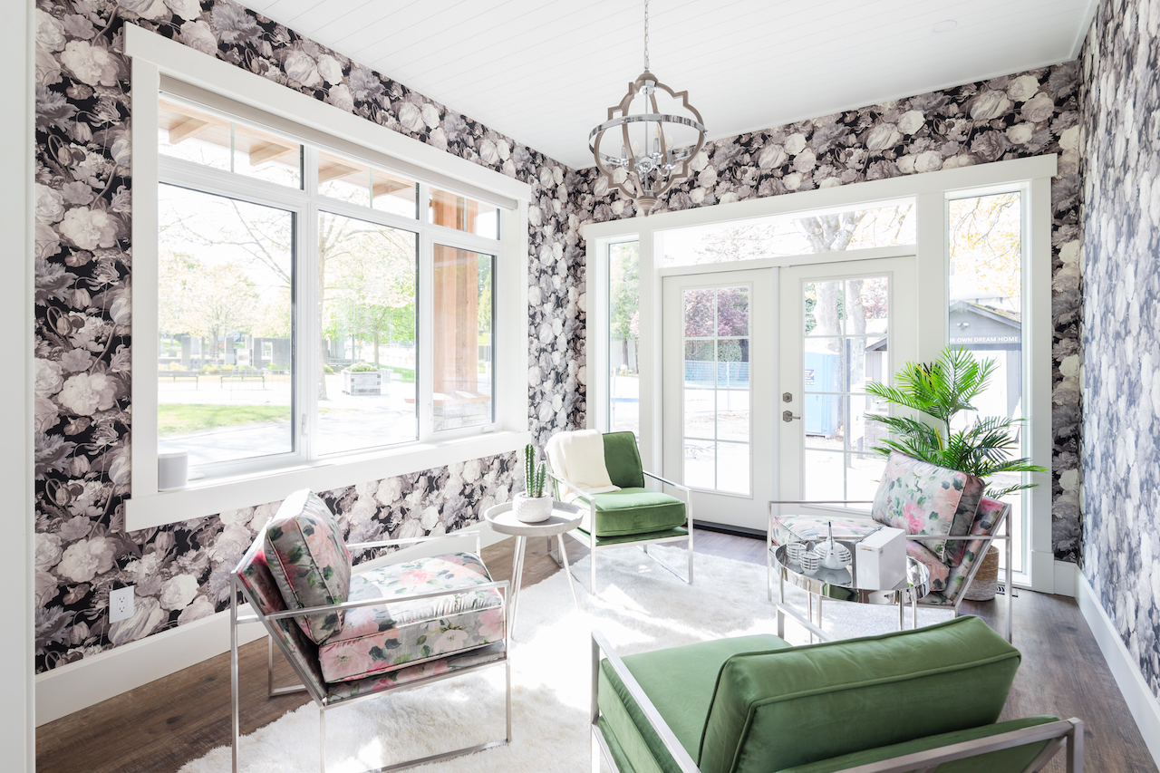 Statement wallpaper provides a bold accent in the corner-situated tea room