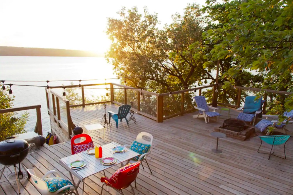 Deck overlooking water at Airbnb lakefront cottage
