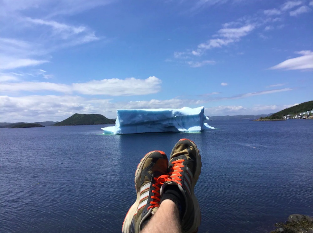 View of iceberg in the ocean view from cottage deck in Newfoundland