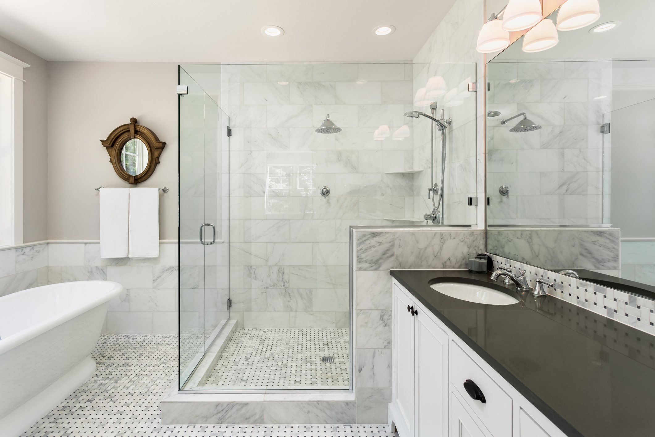 black, white and grey tile in a traditional bathroom