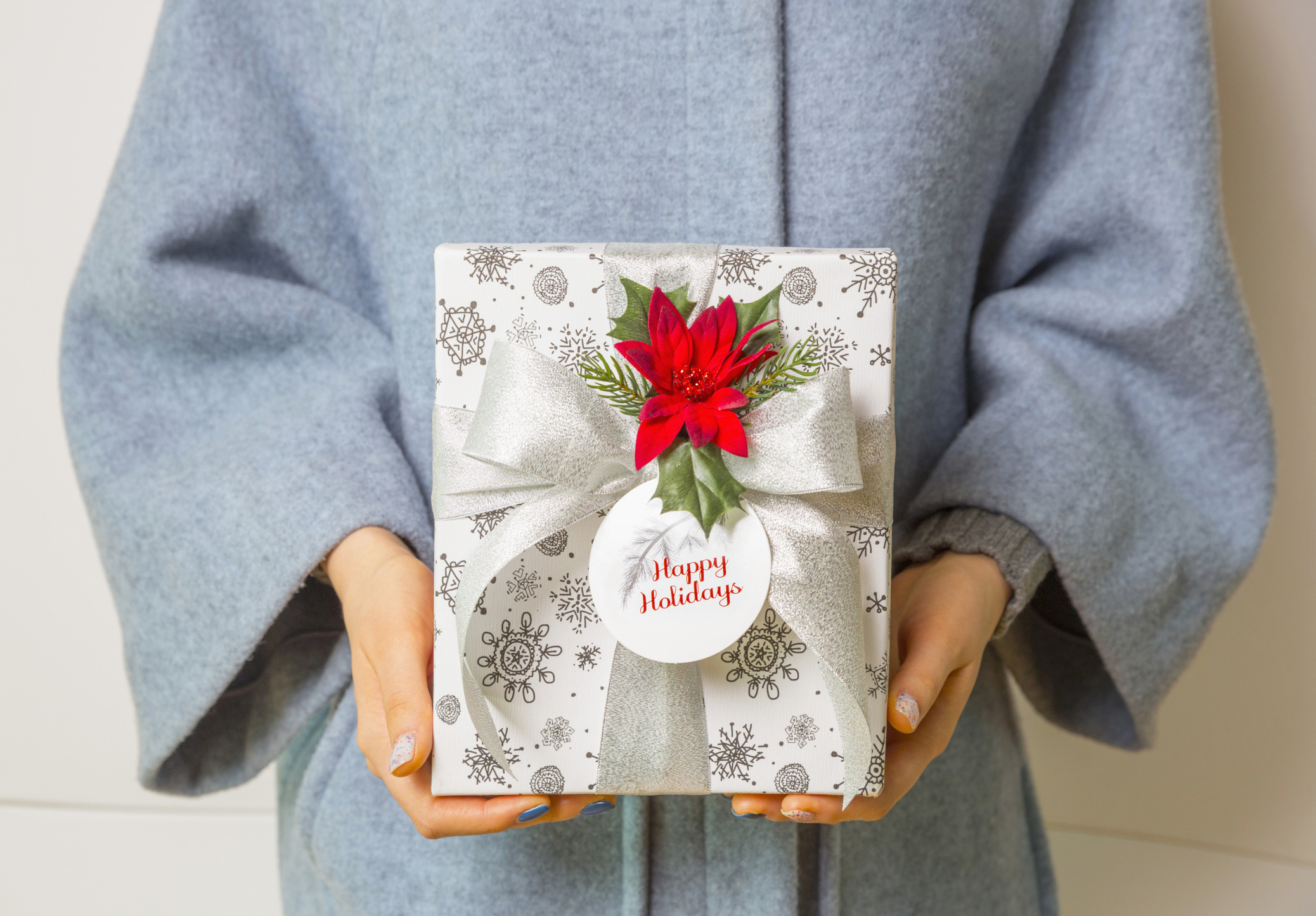 Woman holding holiday gift