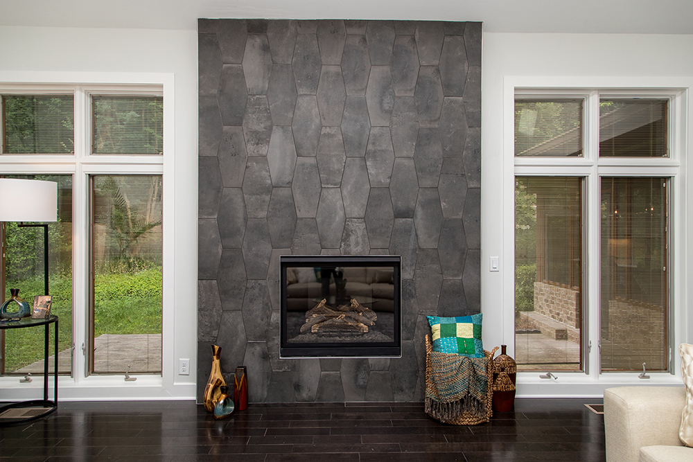 Floor-to-ceiling geometric tile on fireplace