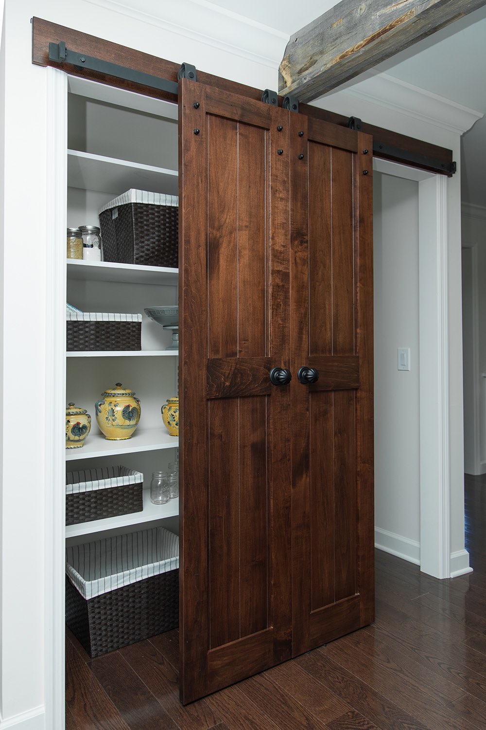 Kitchen pantry with sliding reclaimed barn door