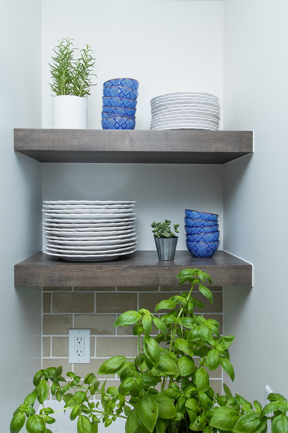 open kitchen shelving with potted plants