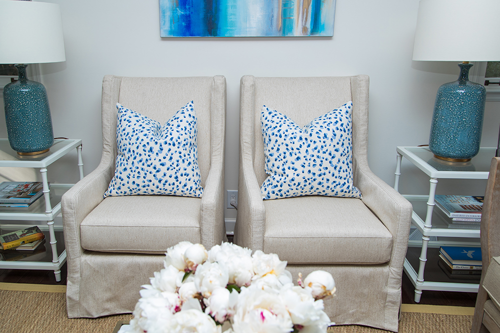 Matching armchairs with blue spotted pillows