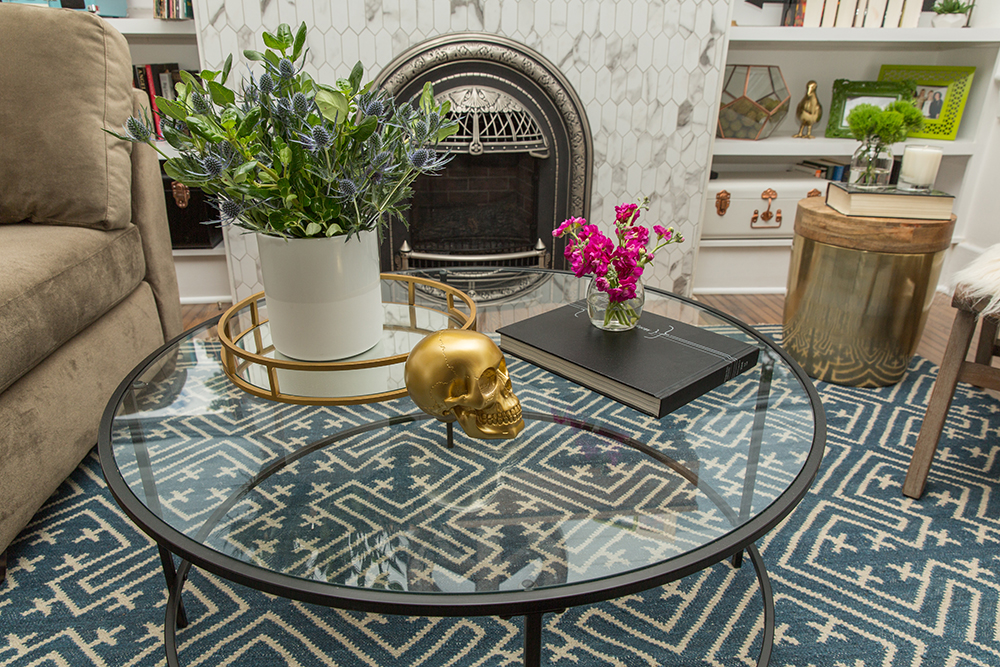 Gold skull on glass coffee table