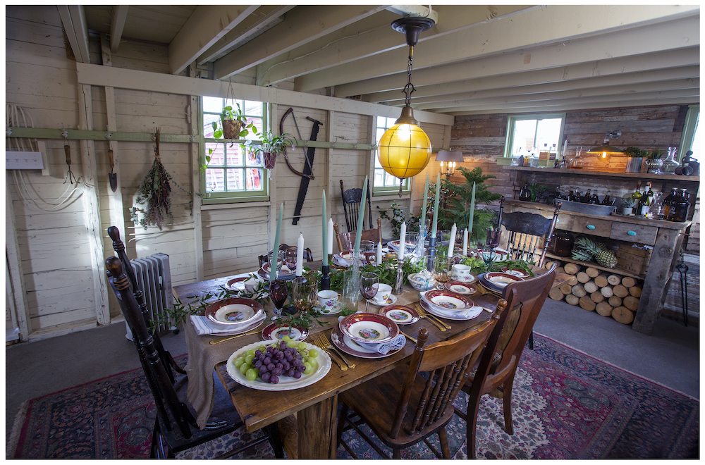 rustic barn lower level with wood harvest table and pendant light