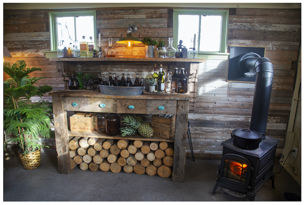 wooden bar and iron stove in barn