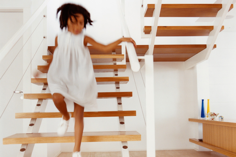 Child running down the stairs