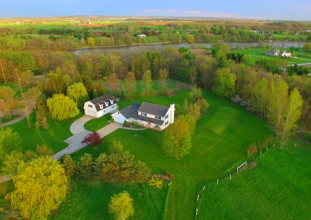 Aerial shot of home with immaculate landscaping