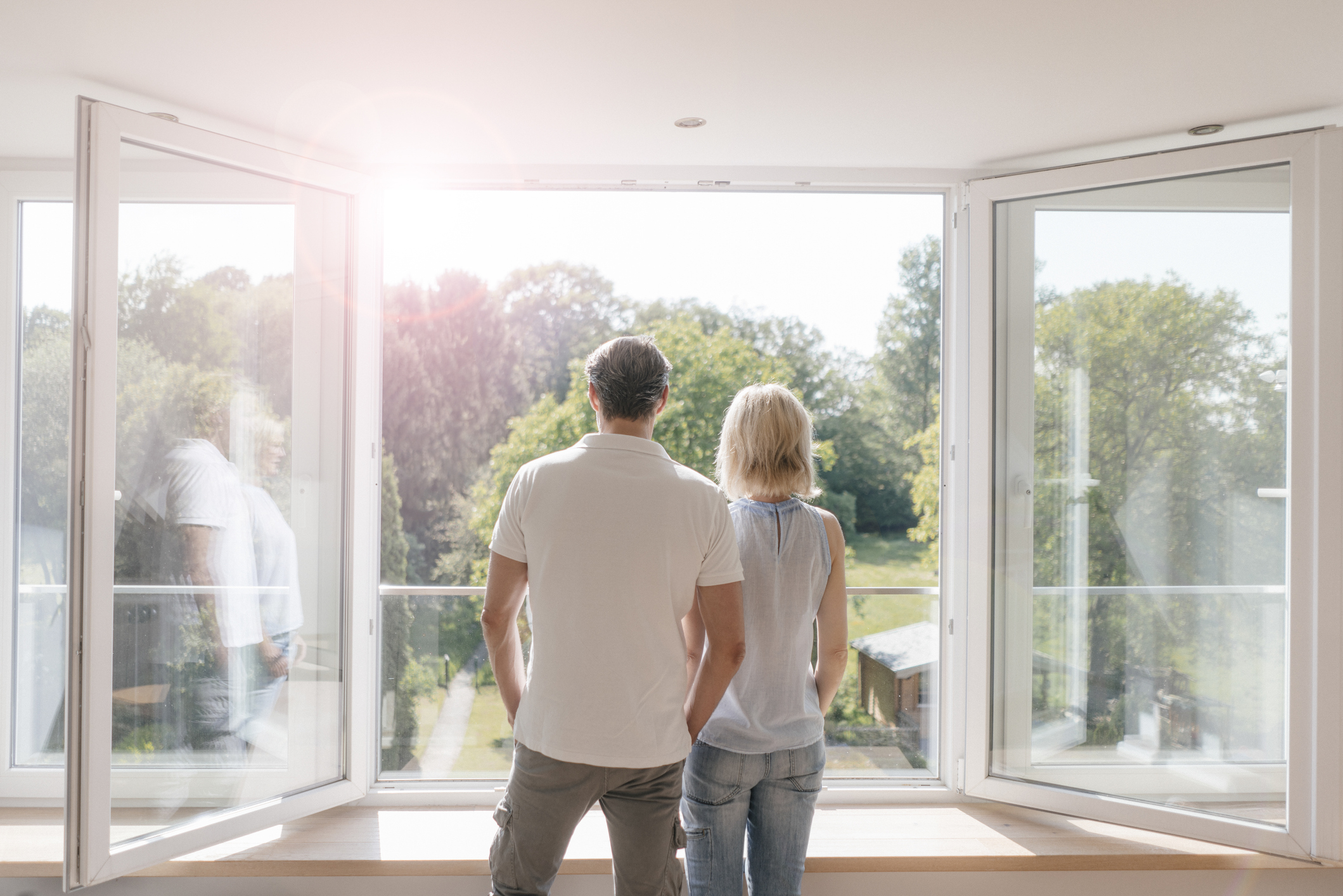 Couple standing in front of new open windows