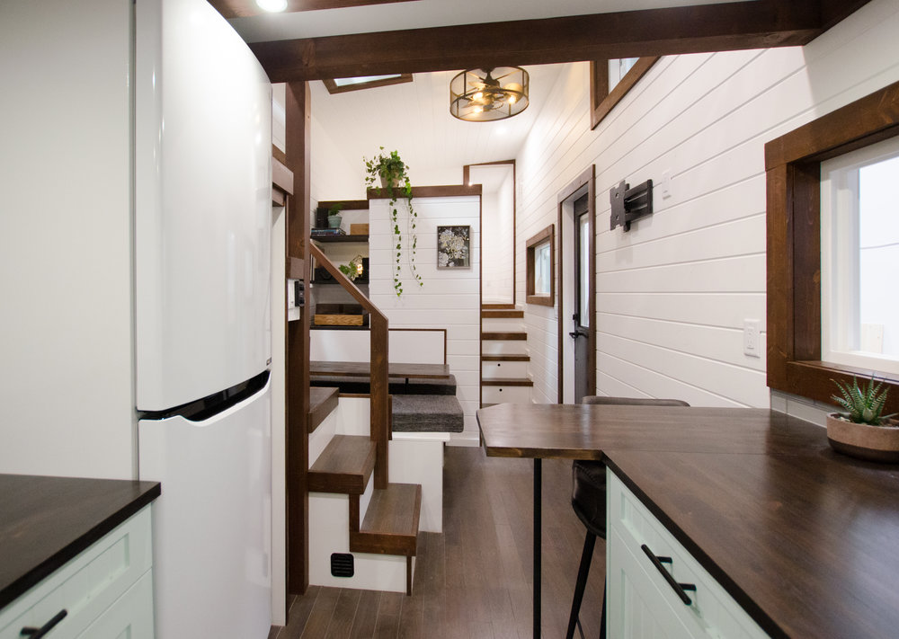white and wood kitchen in tiny home