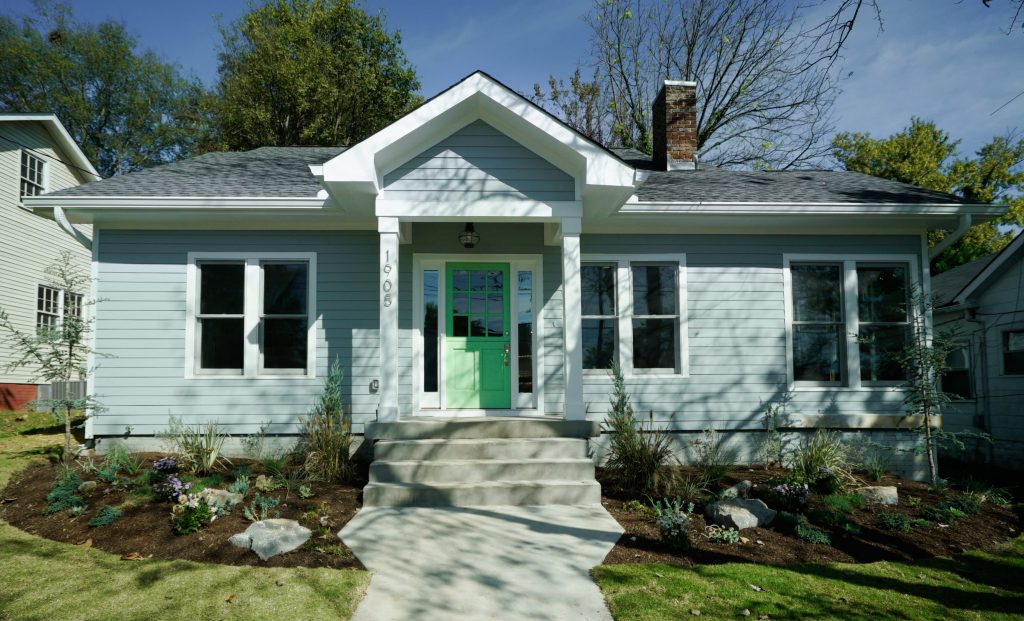 Mint house with green door