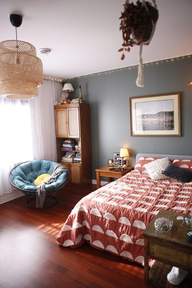 grey wall bedroom with rattan pendant light