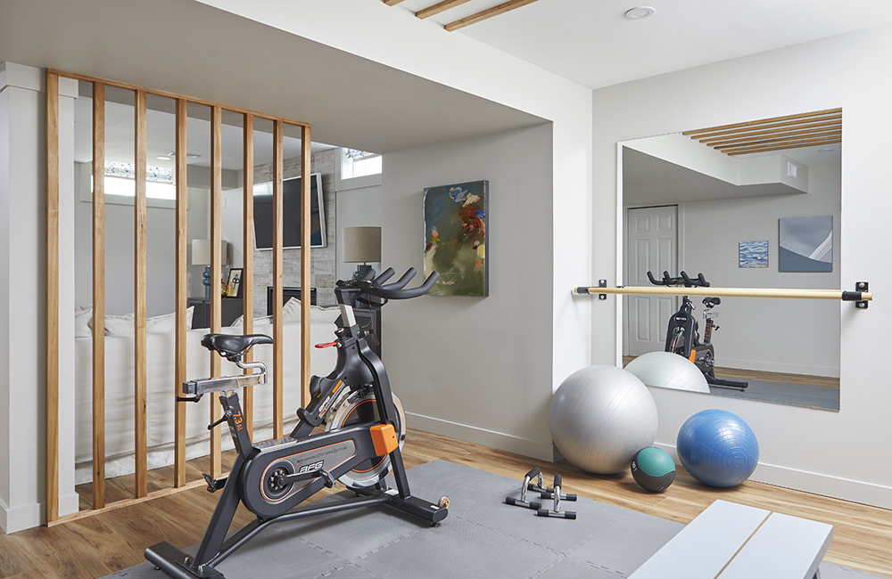 A basement gym with weights and lifecycle.