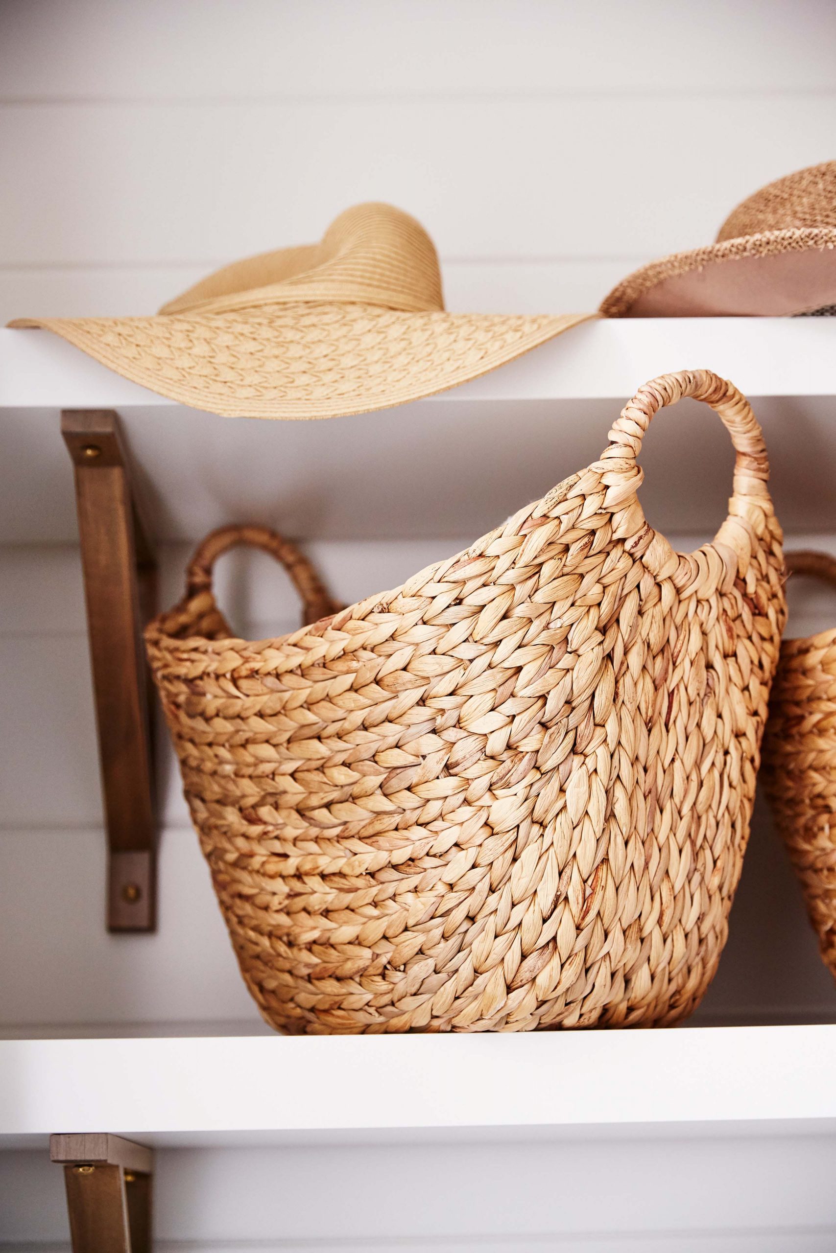 Baskets are a surefire way to keep any mudroom looking neat and organized.