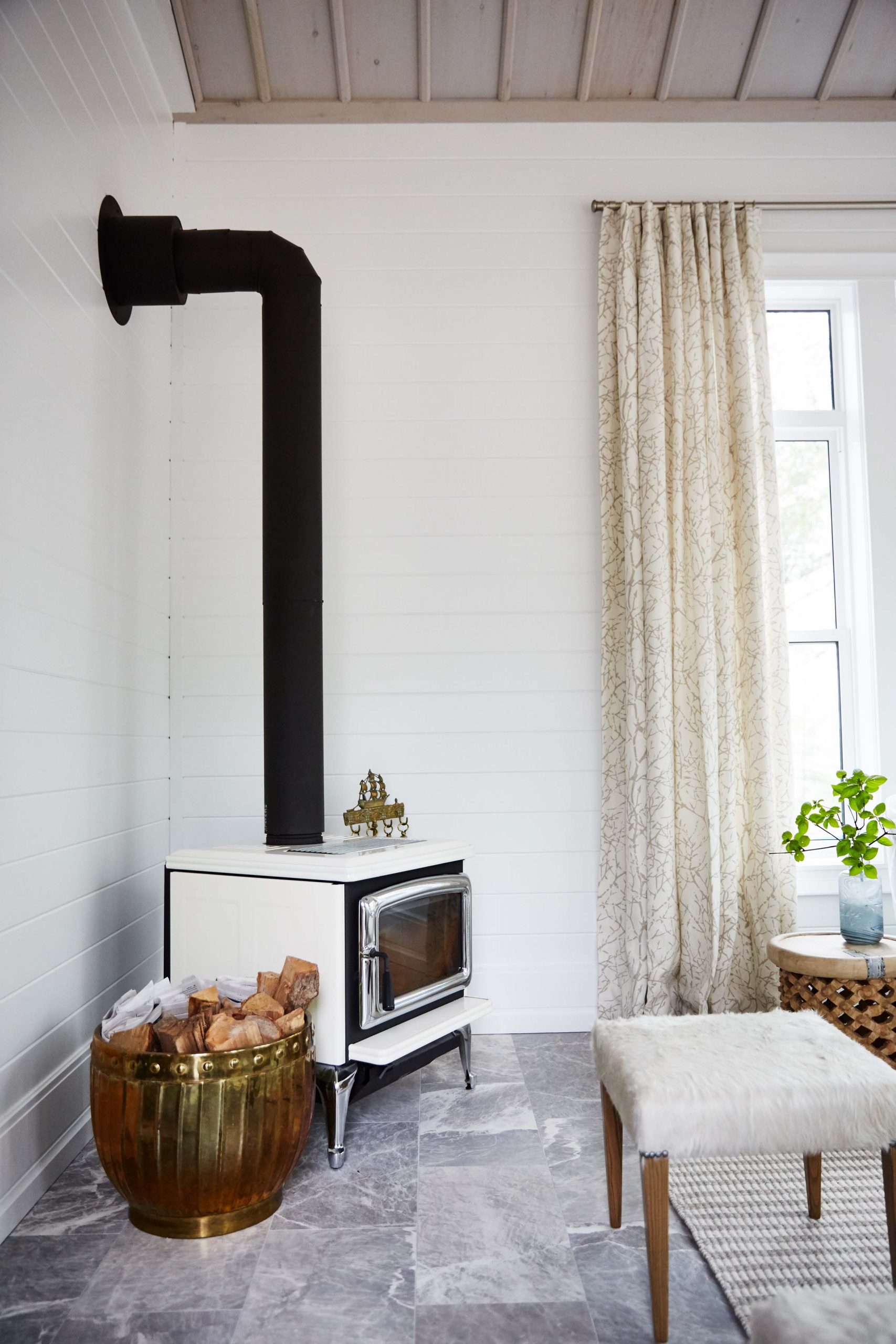 A vintage fireplace stove adds instant charm and character.