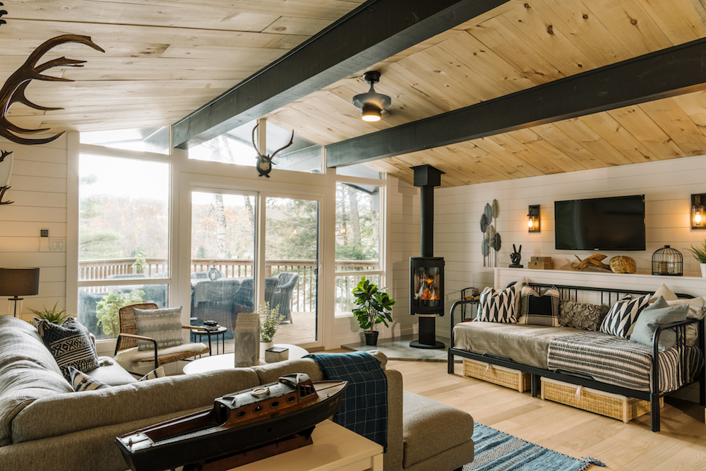 white cottage living room with beams and wood on ceiling