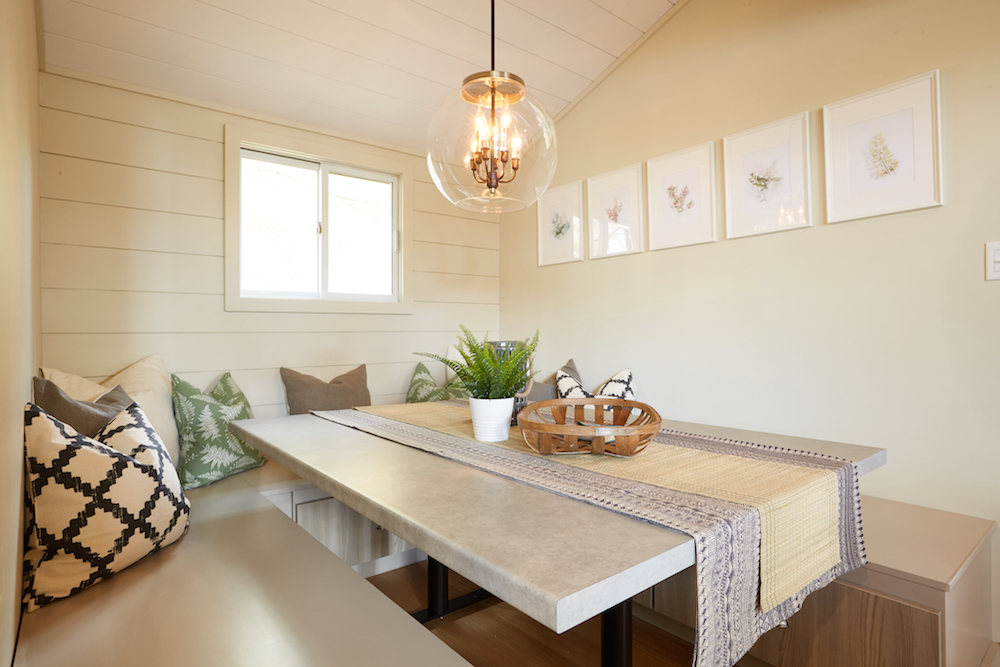 neutral colour dining room with pendent light