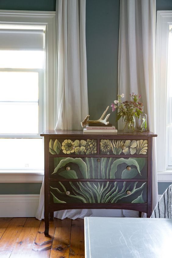 Dresser with green floral design painted on