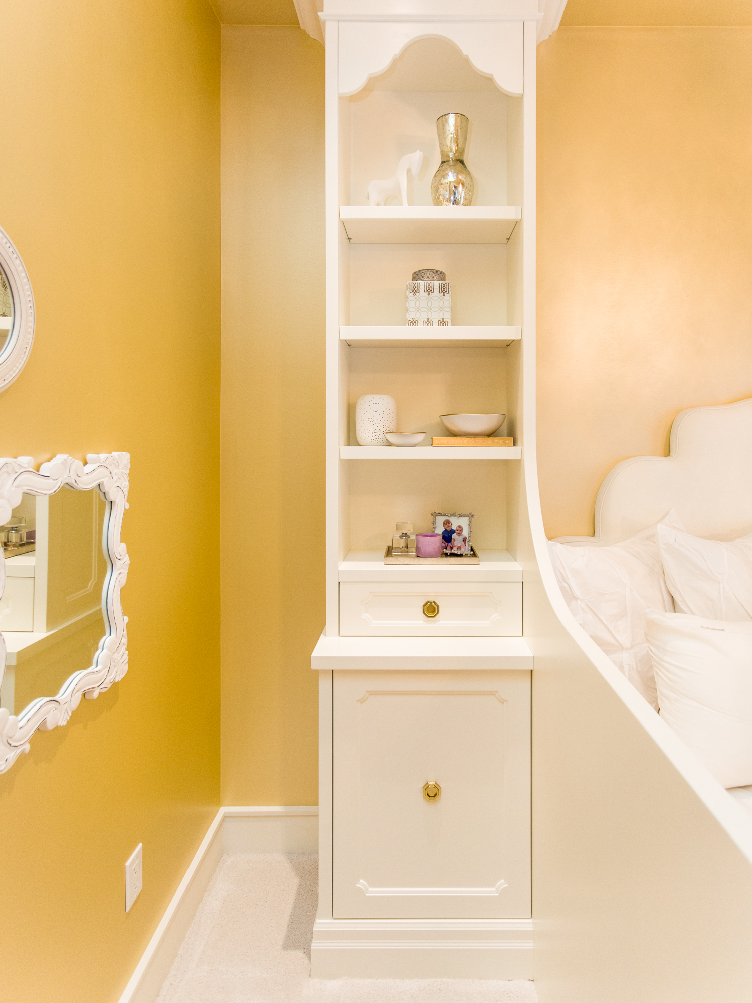 Custom built-in shelves in little girl's bedroom