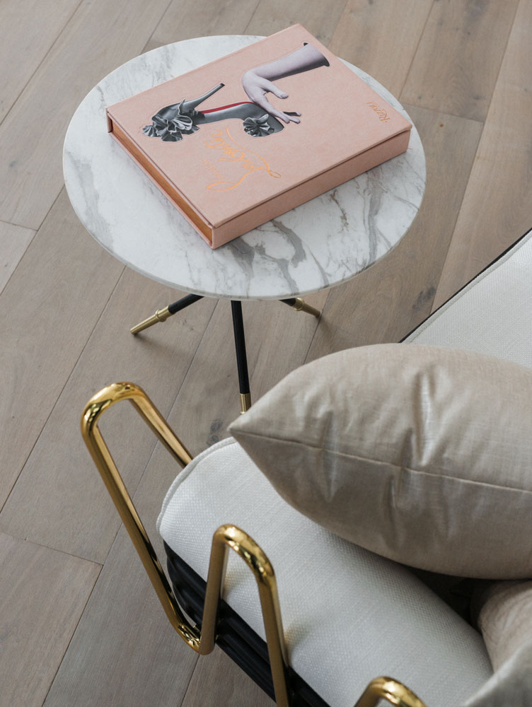 Pink Fashion Book Displayed on Marble Coffee Table