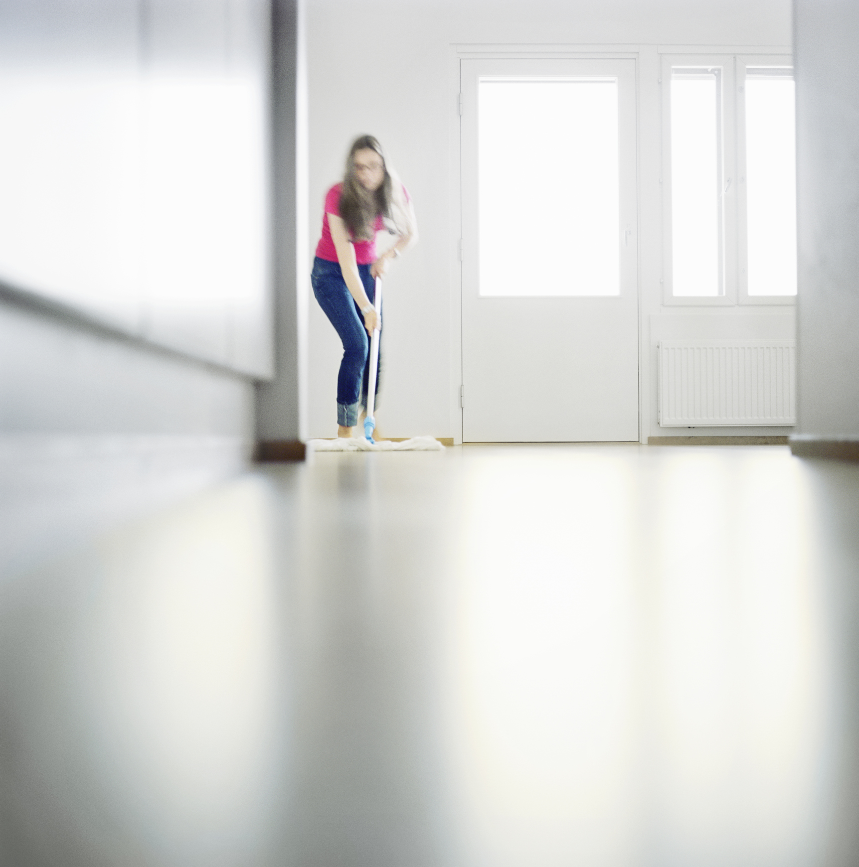 Woman mopping the floor