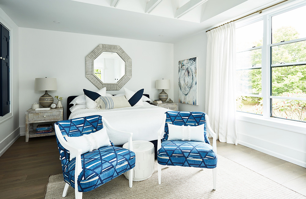 A white bedroom with blue accents