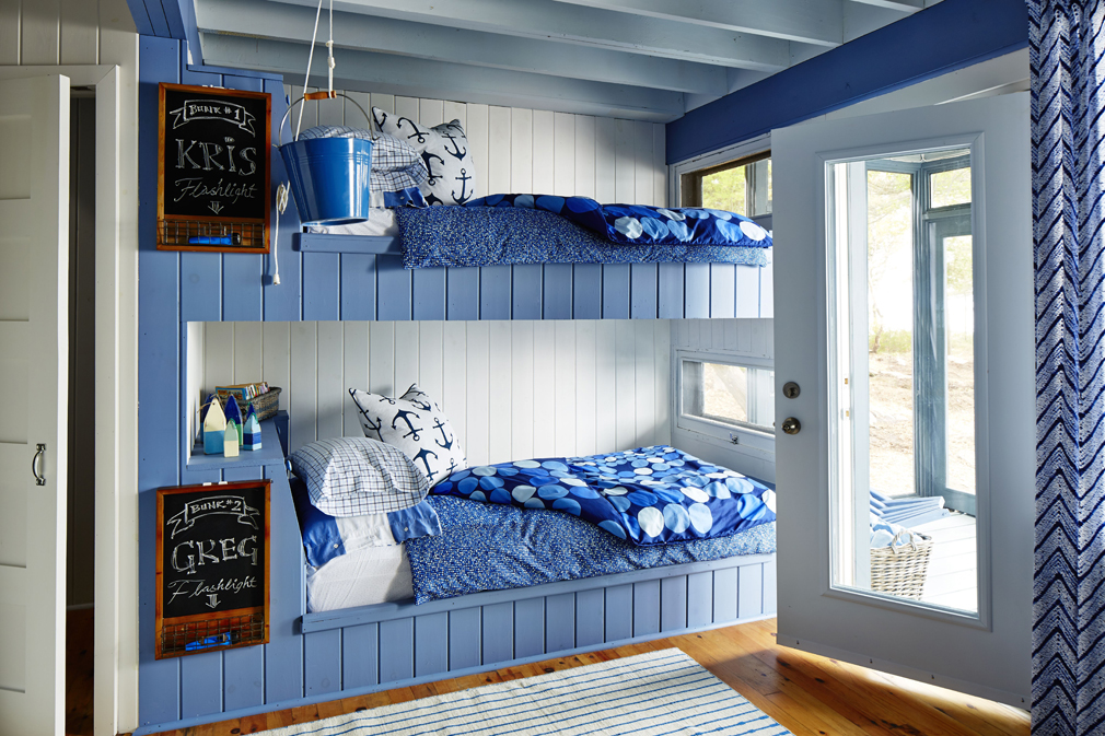 A bright blue coastal-inspired kids' room.