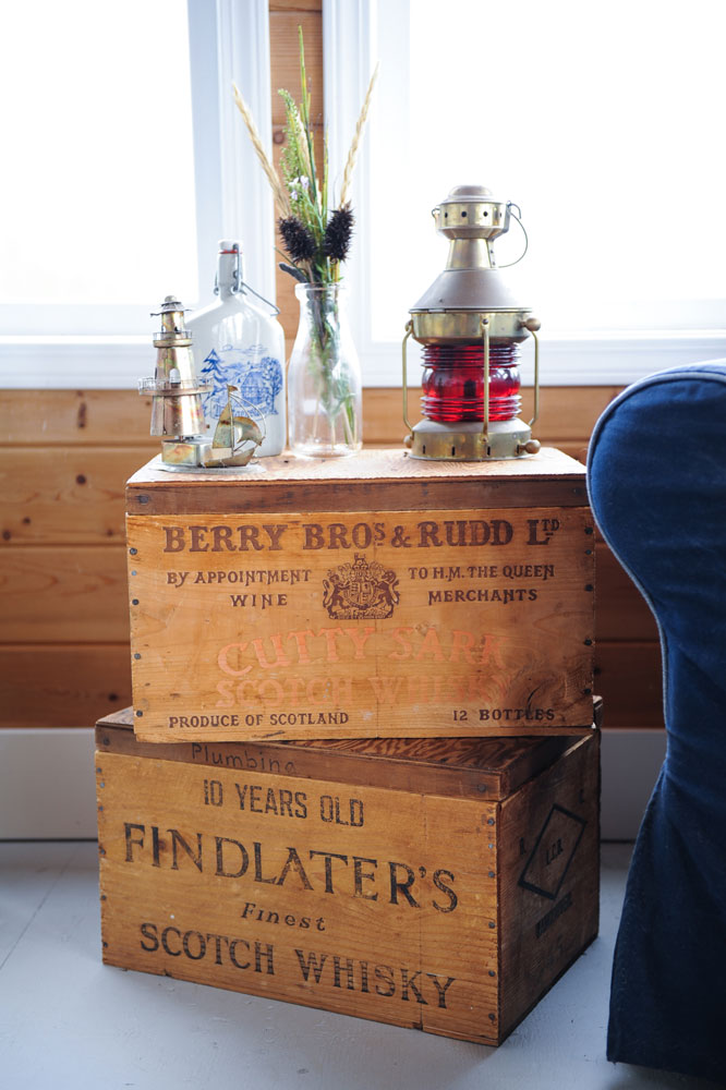two wood wine crates used as sidetable