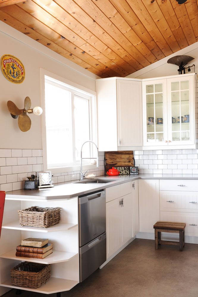 corner of cottage kitchen with wooden ceiling and propeller light sconce