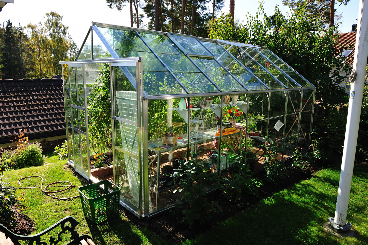 A greenhouse in a backyard