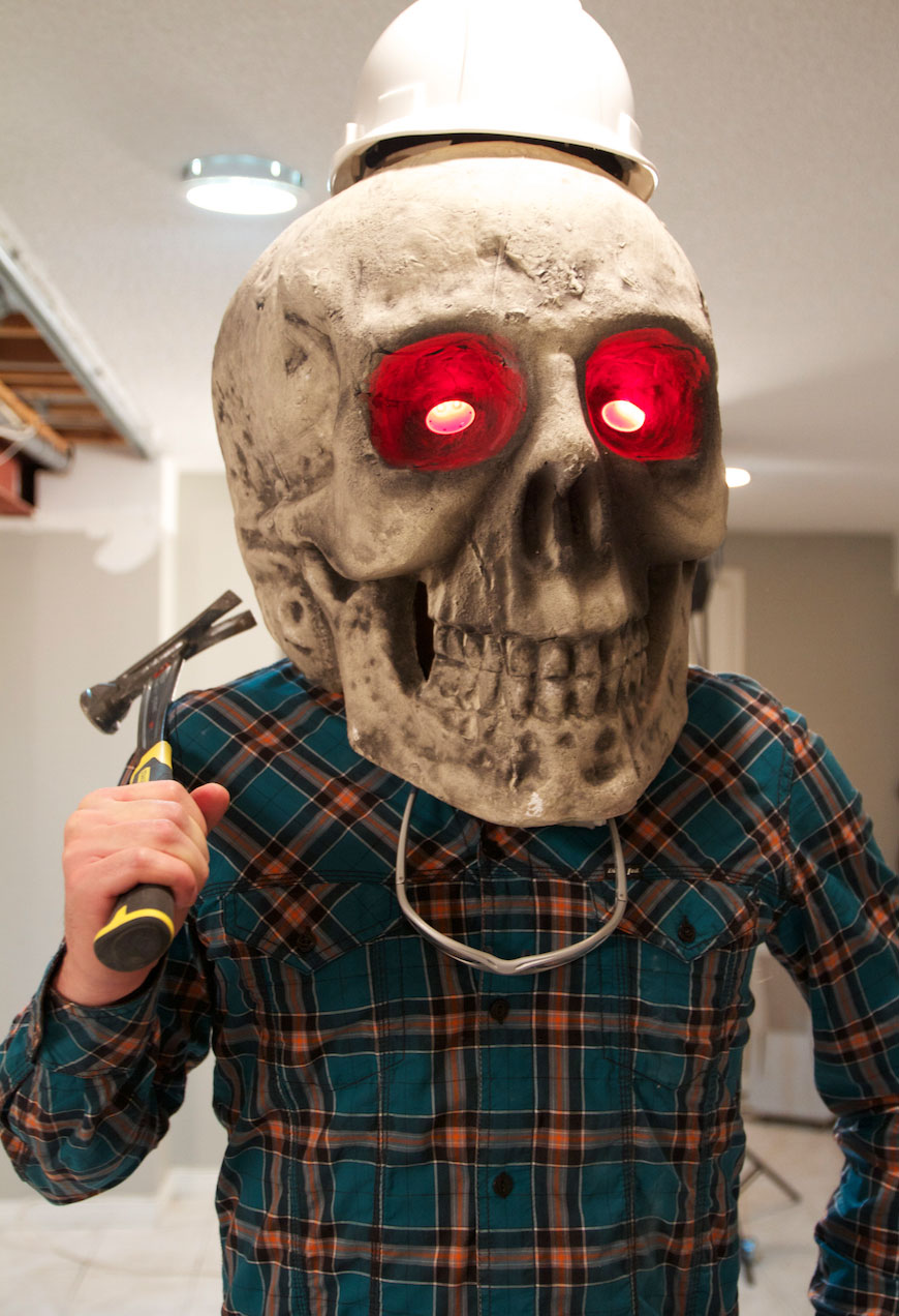 Scott McGillivray wearing a giant zombie head