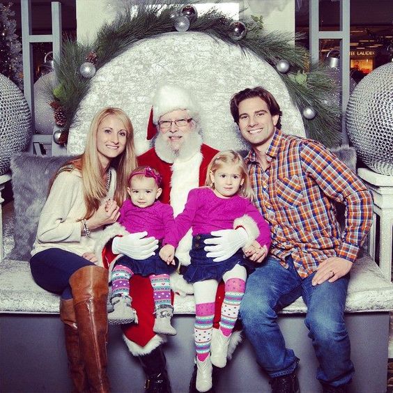The McGillivray family posing with Santa Claus
