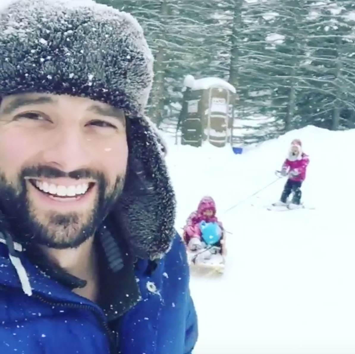 Scott McGillivray playing in snow with daughters