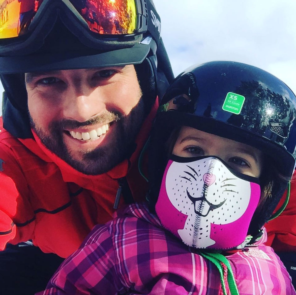 Scott McGillivray with daughter wearing bunny ski mask