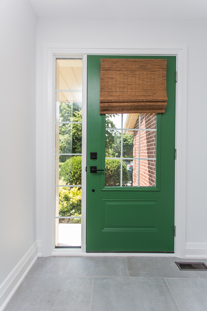 A welcoming green, front door.