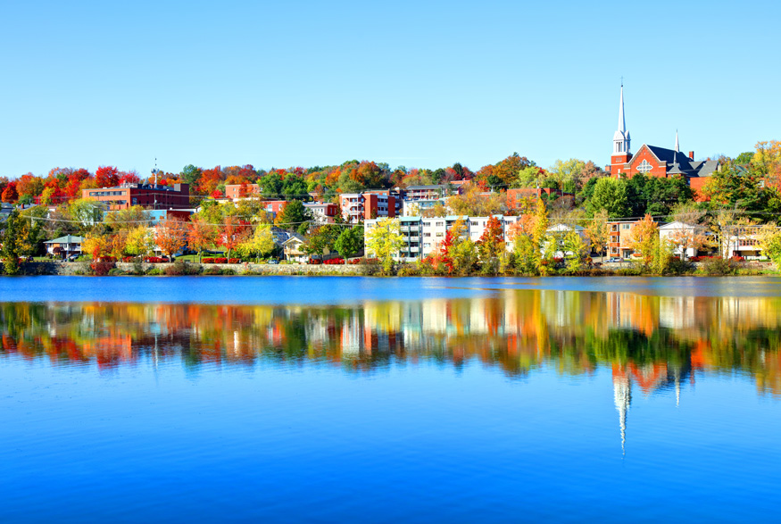 A vibrant shot of the city of Sherbrooke, Quebec from the water