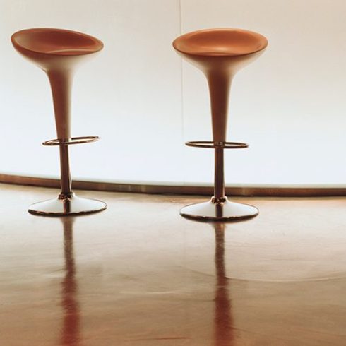 Shiny floor with bar stools