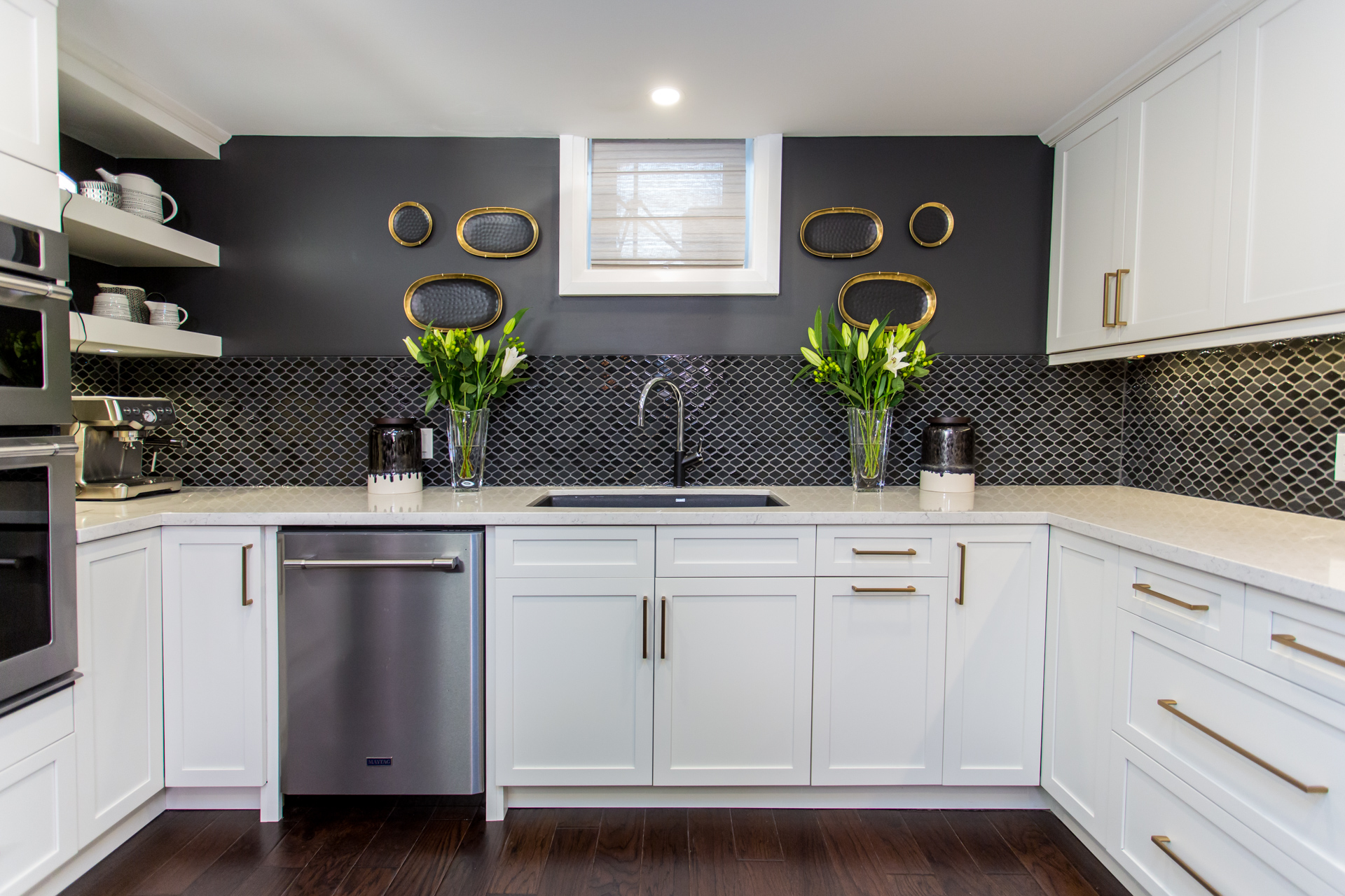 Basement kitchen with black tile backsplash