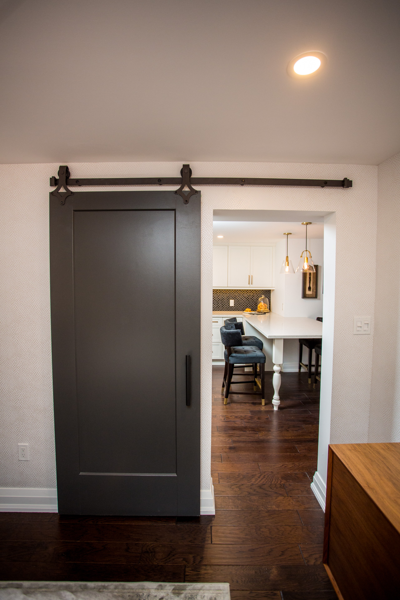 Black sliding door in basement apartment