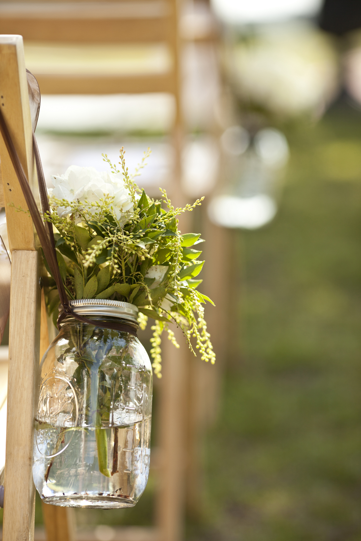 Mason jar flower vase at wedding