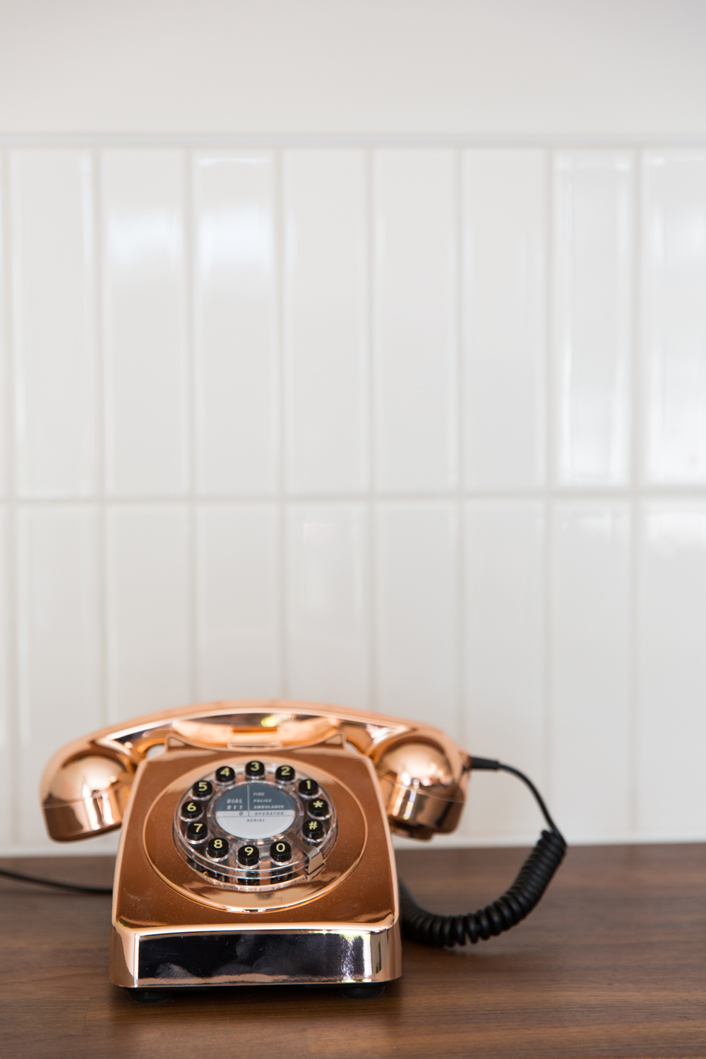 rose gold telephone on table